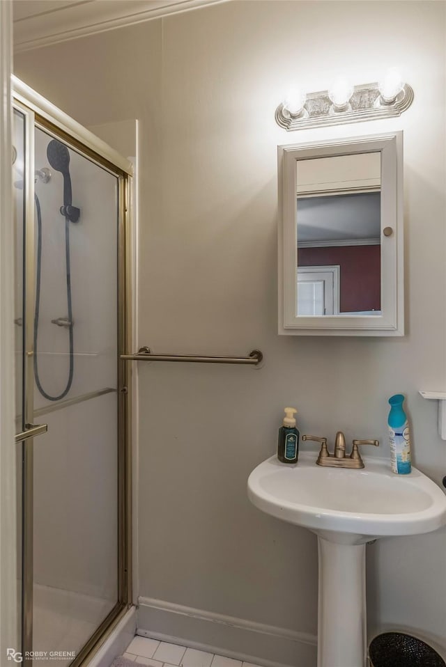 3933 Baltimore Ave, Shreveport, LA 71106 - bathroom with a shower stall and tile patterned floors