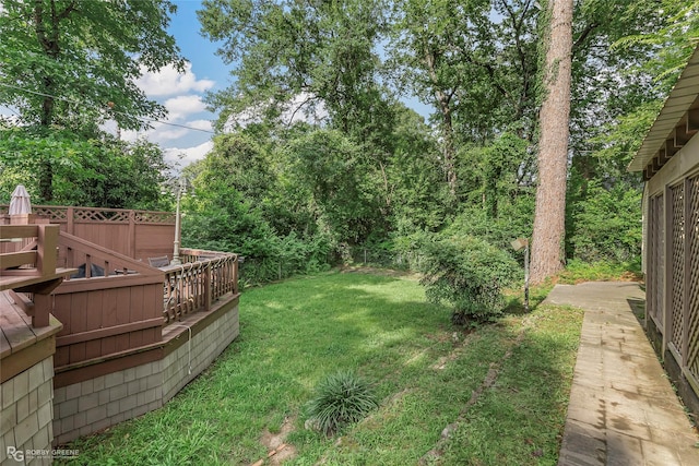3933 Baltimore Ave, Shreveport, LA 71106 - view of green lawn with a deck
