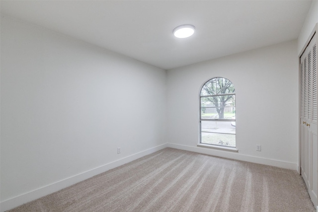 3525 S Elm Dr, Grand Prairie, TX 75052 - unfurnished bedroom with light carpet and a closet