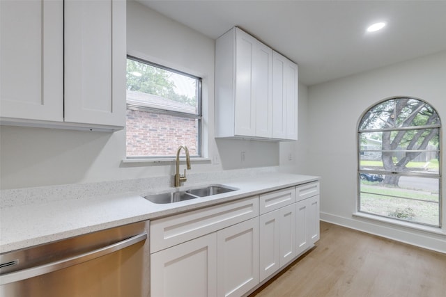 3525 S Elm Dr, Grand Prairie, TX 75052 - kitchen with stainless steel dishwasher, white cabinets, light wood finished floors, recessed lighting, and light stone counters
