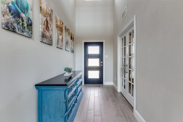 11825 Wulstone Rd, Fort Worth, TX 76052 - entrance foyer with wood finished floors and french doors