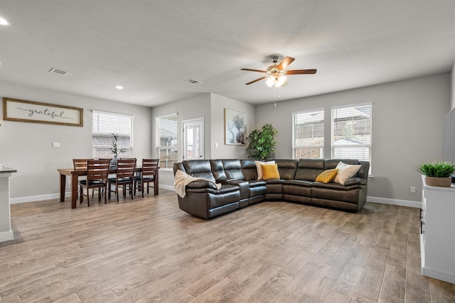 171 Tanager Dr, Rhome, TX 76078 - living room featuring ceiling fan, light wood-style floors, healthy amount of natural light, and recessed lighting