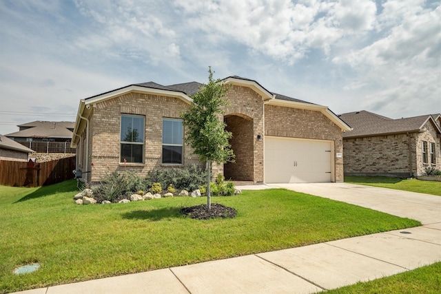 171 Tanager Dr, Rhome, TX 76078 - view of front facade with brick siding, an attached garage, and concrete driveway