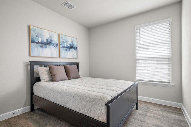 171 Tanager Dr, Rhome, TX 76078 - bedroom featuring wood finished floors and multiple windows