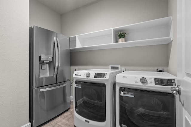 171 Tanager Dr, Rhome, TX 76078 - washroom with separate washer and dryer and light wood finished floors