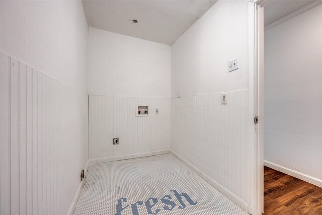917 W Washington St, Sherman, TX 75092 - laundry area with hookup for an electric dryer, hookup for a washing machine, wainscoting, and wood finished floors