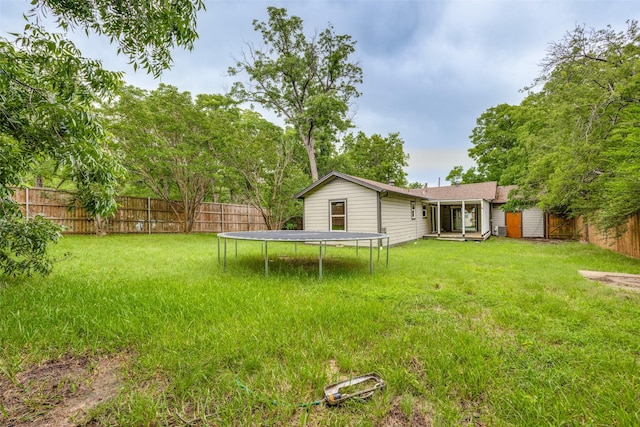 917 W Washington St, Sherman, TX 75092 - fenced backyard featuring a trampoline