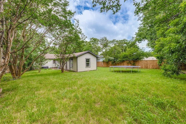 917 W Washington St, Sherman, TX 75092 - fenced backyard featuring a trampoline