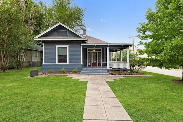 5502 Victor, Dallas, TX 75214 - view of front of home with a porch, a front yard, and a chimney