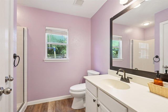 312 Robertson St, Denton, TX 76205 - full bath with healthy amount of natural light, wood finished floors, vanity, and a tile shower