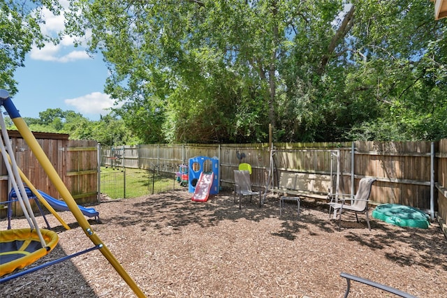 312 Robertson St, Denton, TX 76205 - fenced backyard featuring a playground