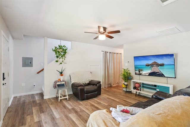 312 Robertson St, Denton, TX 76205 - living area featuring wood finished floors, electric panel, and ceiling fan