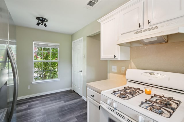 312 Robertson St, Denton, TX 76205 - kitchen featuring white gas range, under cabinet range hood, white cabinetry, light countertops, and dark wood-style floors