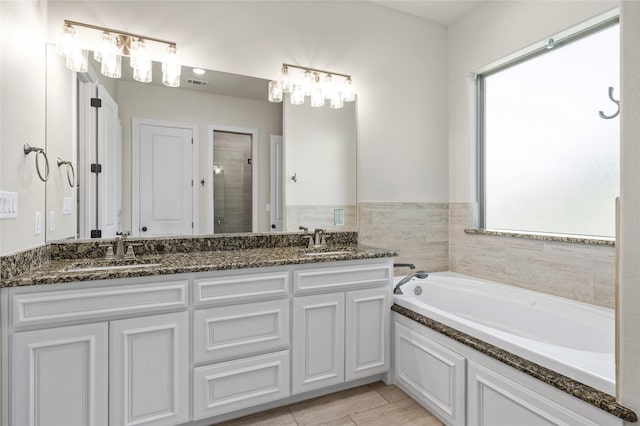 2604 Silverado Trl, Sherman, TX 75092 - full bath featuring plenty of natural light, a garden tub, a stall shower, and double vanity