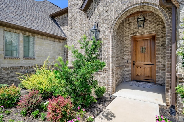 2604 Silverado Trl, Sherman, TX 75092 - view of exterior entry with brick siding and roof with shingles