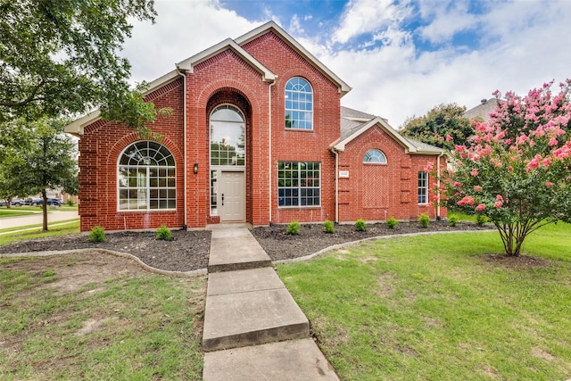 1432 Stillforest Dr, Allen, TX 75002 - traditional-style house featuring brick siding and a front lawn