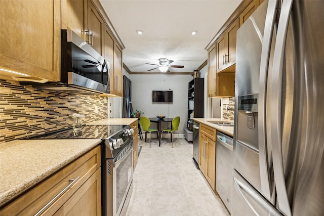 11330 Park Central Pl Unit C, Dallas, TX 75230 - kitchen featuring stainless steel appliances, decorative backsplash, ceiling fan, ornamental molding, and light countertops