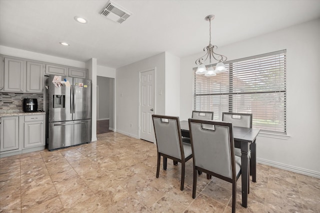 5603 Farris Dr, Arlington, TX 76017 - dining room with a chandelier, recessed lighting, and light stone finish flooring