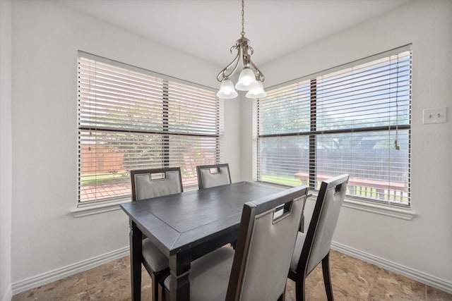 5603 Farris Dr, Arlington, TX 76017 - dining space featuring baseboards and a chandelier