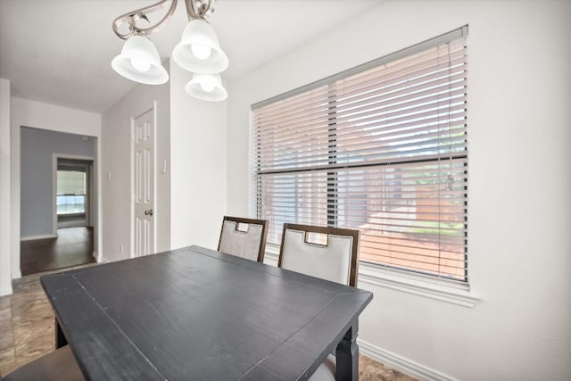 5603 Farris Dr, Arlington, TX 76017 - dining area with a chandelier and baseboards