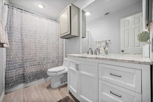 5603 Farris Dr, Arlington, TX 76017 - full bath with vanity, recessed lighting, wood finished floors, and curtained shower