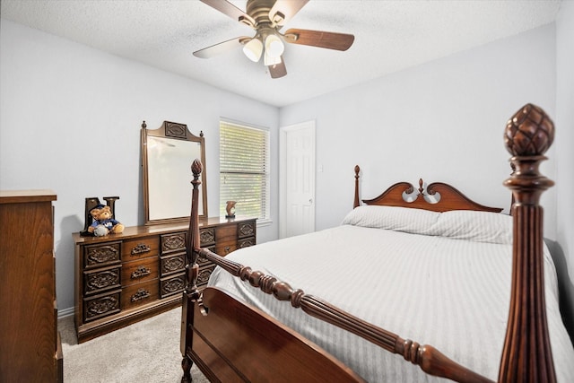 5603 Farris Dr, Arlington, TX 76017 - bedroom with carpet floors, ceiling fan, and a textured ceiling