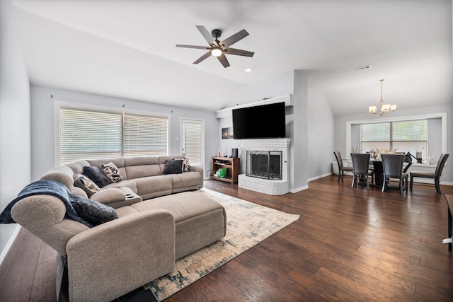 5603 Farris Dr, Arlington, TX 76017 - living area with vaulted ceiling, a chandelier, a ceiling fan, a brick fireplace, and dark wood-style flooring