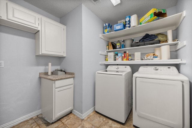 5603 Farris Dr, Arlington, TX 76017 - laundry area with separate washer and dryer, cabinet space, and a textured ceiling