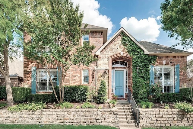 946 Briar Oaks Dr, Rockwall, TX 75087 - view of front facade with brick siding and roof with shingles