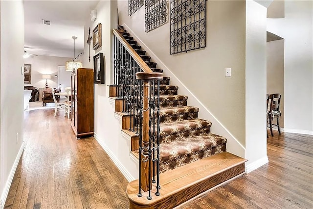 946 Briar Oaks Dr, Rockwall, TX 75087 - stairs featuring wood finished floors and baseboards