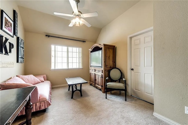 946 Briar Oaks Dr, Rockwall, TX 75087 - sitting room with light colored carpet, lofted ceiling, a ceiling fan, and a textured wall