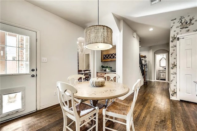 946 Briar Oaks Dr, Rockwall, TX 75087 - dining room with wood finished floors, recessed lighting, and arched walkways