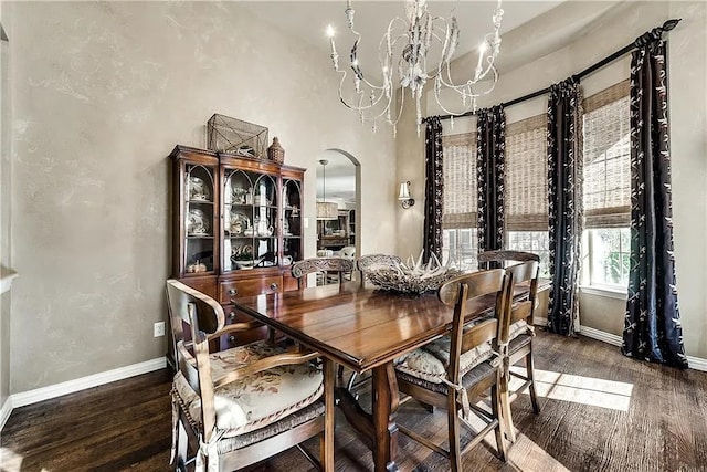 946 Briar Oaks Dr, Rockwall, TX 75087 - dining space featuring a chandelier, wood finished floors, and arched walkways