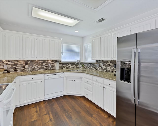 3937 Marsh Ln, Fort Worth, TX 76123 - kitchen featuring stainless steel fridge with ice dispenser, white dishwasher, stove, tasteful backsplash, and dark wood finished floors