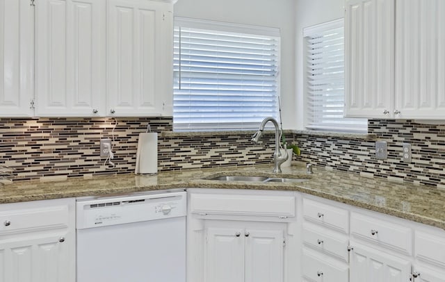 3937 Marsh Ln, Fort Worth, TX 76123 - kitchen with white dishwasher, white cabinets, decorative backsplash, and light stone counters