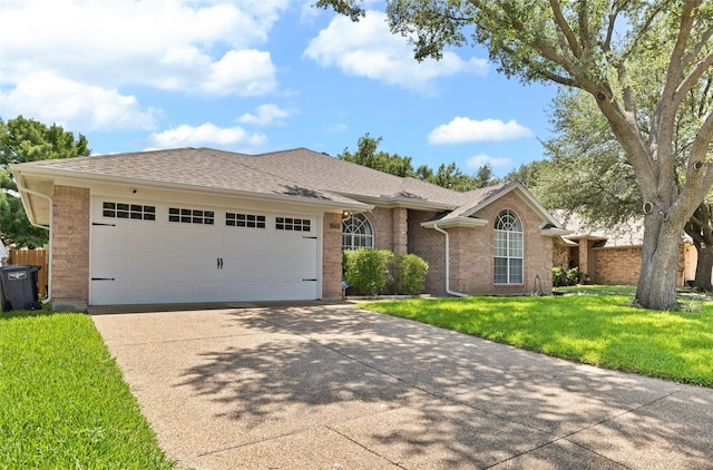 3937 Marsh Ln, Fort Worth, TX 76123 - single story home with concrete driveway, an attached garage, brick siding, a front yard, and a shingled roof
