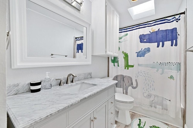 3937 Marsh Ln, Fort Worth, TX 76123 - bathroom with a skylight, vanity, wood finished floors, and shower / bath combination with curtain
