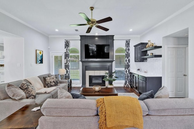 3937 Marsh Ln, Fort Worth, TX 76123 - living room with a fireplace with flush hearth, ceiling fan, healthy amount of natural light, wood finished floors, and ornamental molding