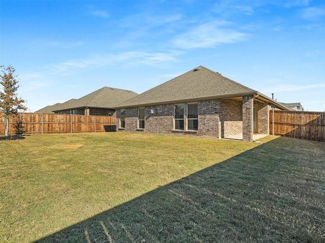 2800 Cain Dr, Anna, TX 75409 - back of house featuring brick siding, a fenced backyard, and a shingled roof
