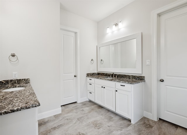 2751 Langley Way, Prosper, TX 75078 - full bath featuring two vanities and baseboards