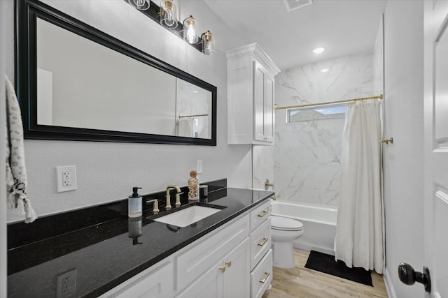 12457 Maplewood Dr, Lindale, TX 75771 - bathroom featuring vanity, shower / bath combination with curtain, and wood finished floors