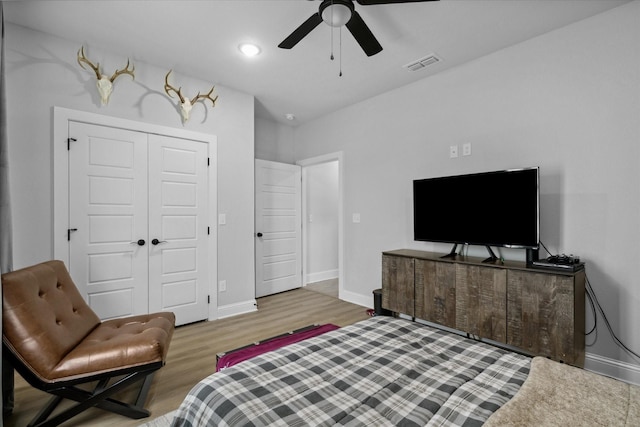12457 Maplewood Dr, Lindale, TX 75771 - bedroom featuring wood finished floors, a closet, and a ceiling fan