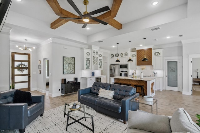 12457 Maplewood Dr, Lindale, TX 75771 - living area featuring beverage cooler, a ceiling fan, light wood-style flooring, recessed lighting, and crown molding