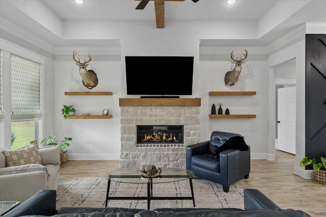 12457 Maplewood Dr, Lindale, TX 75771 - living room with wood finished floors, ceiling fan, a fireplace, and recessed lighting