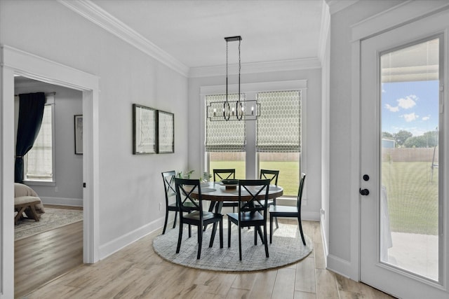 12457 Maplewood Dr, Lindale, TX 75771 - dining area featuring ornamental molding, light wood-style floors, and a chandelier