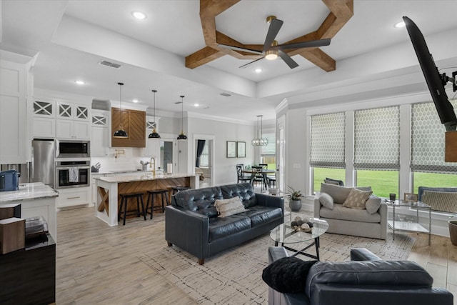 12457 Maplewood Dr, Lindale, TX 75771 - living area with coffered ceiling, ceiling fan, light wood finished floors, recessed lighting, and beam ceiling