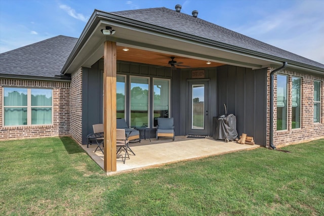 12457 Maplewood Dr, Lindale, TX 75771 - rear view of property featuring roof with shingles, ceiling fan, brick siding, board and batten siding, and a patio