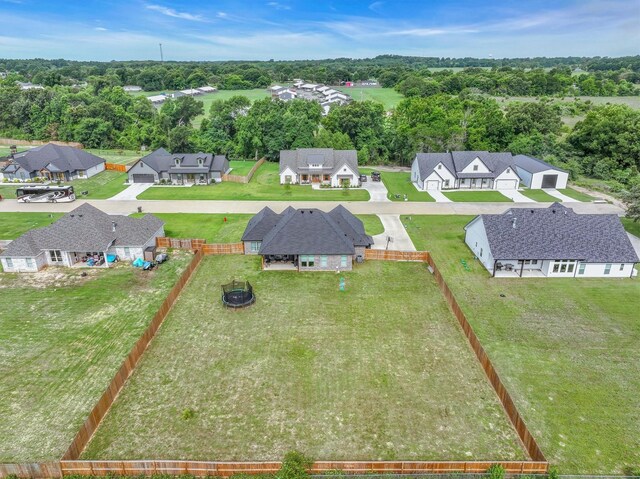 12457 Maplewood Dr, Lindale, TX 75771 - aerial view of residential area with a tree filled landscape