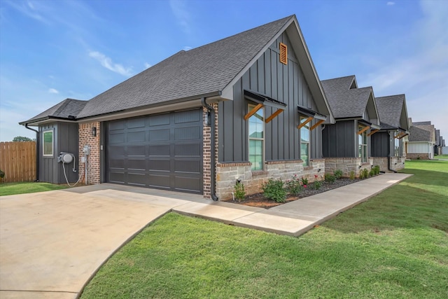 12457 Maplewood Dr, Lindale, TX 75771 - view of front of home featuring board and batten siding, an attached garage, driveway, and roof with shingles