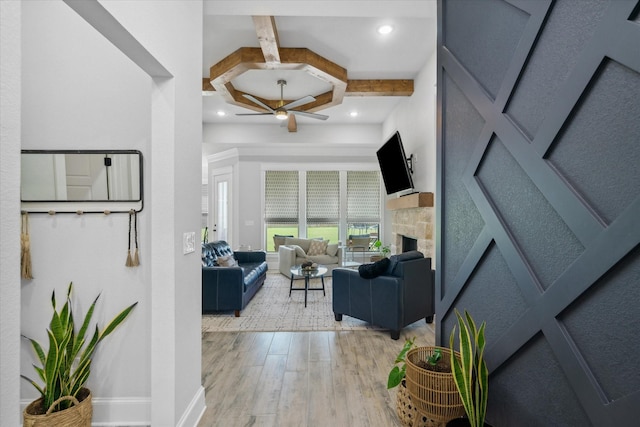 12457 Maplewood Dr, Lindale, TX 75771 - living area featuring light wood-style floors, beam ceiling, ceiling fan, a fireplace, and coffered ceiling